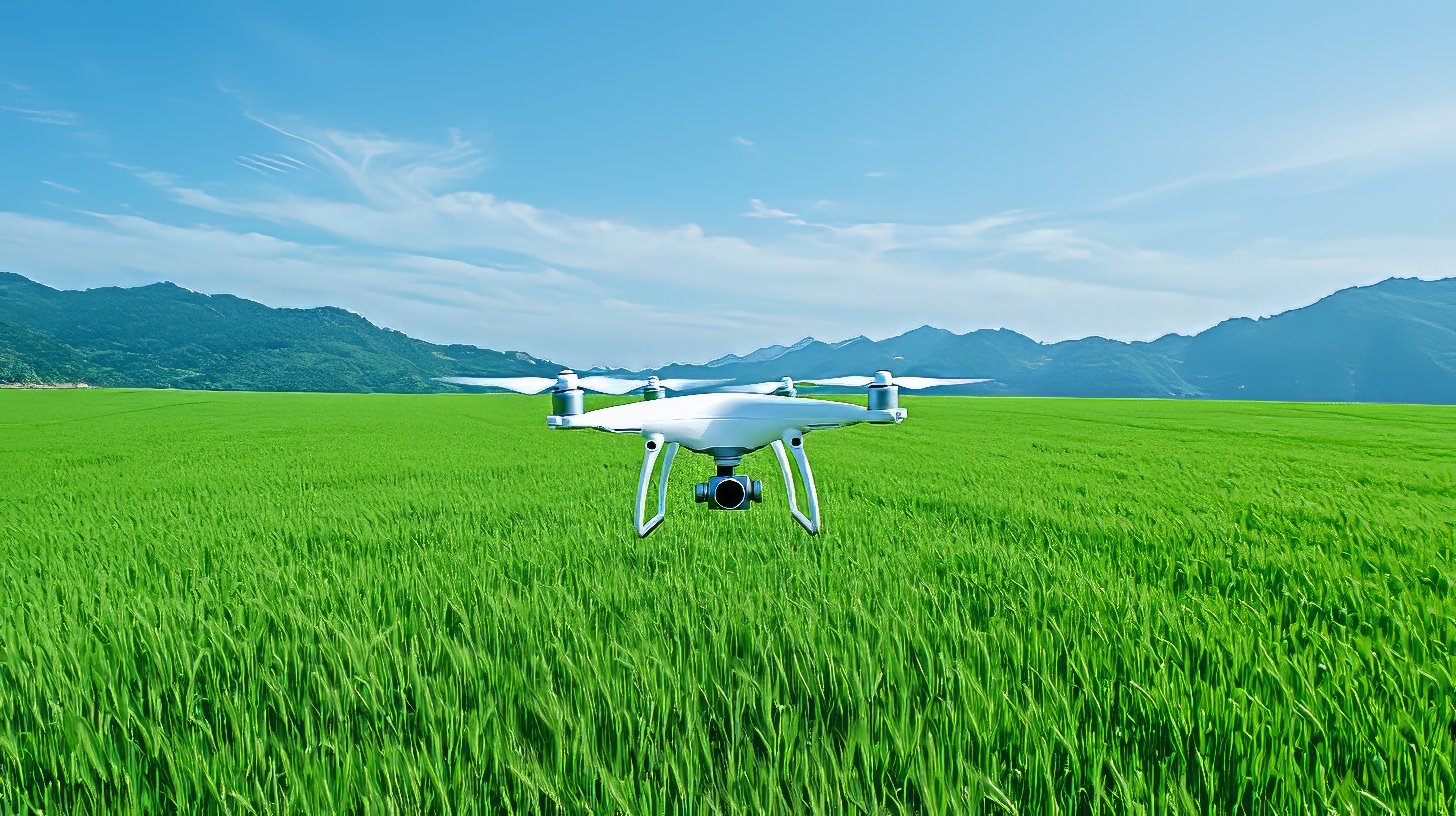 a drone guided by GPS and equipped with a camera above a green field